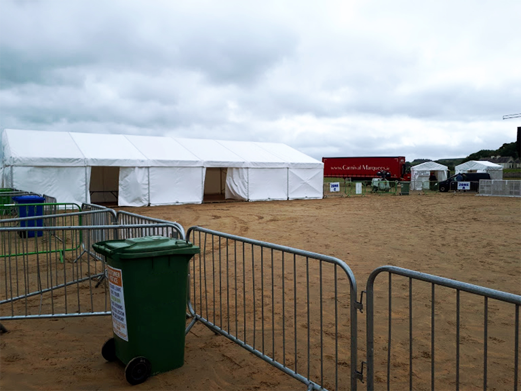 A marquee tent on a beach at a festival