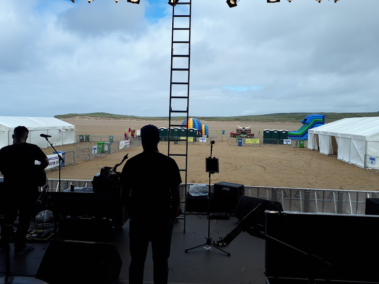 Looking out from a stage at a music festival site build